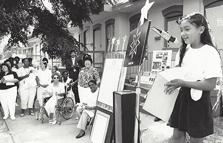 Young girl, age 7 to 10 giving a speech. 